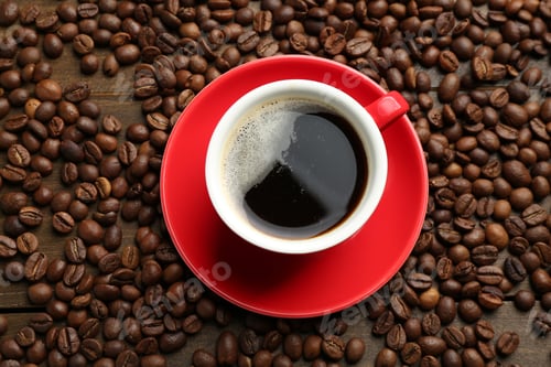 Preview: Aromatic coffee in cup and beans on wooden table, flat lay