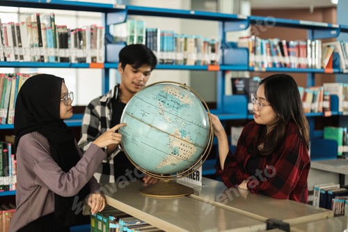Preview: Students learning geography using globe at the classroom