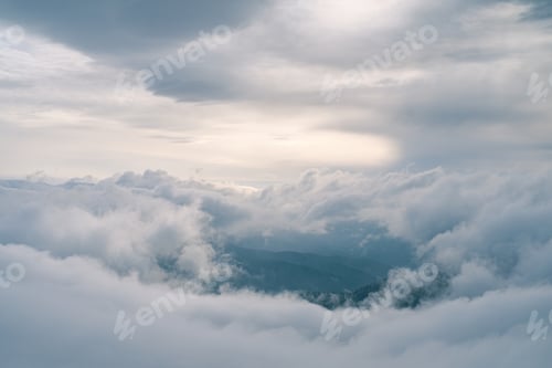 Preview: Flowing clouds in winter mountain at sunset
