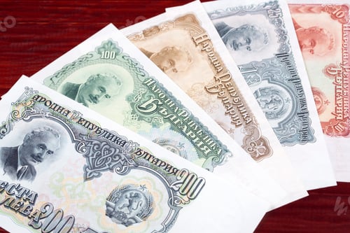 Preview: Bulgarian Currency featuring Historical Figures on Textured Wood