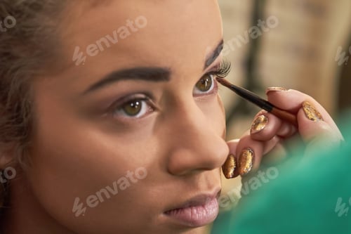 Preview: Hand applying makeup