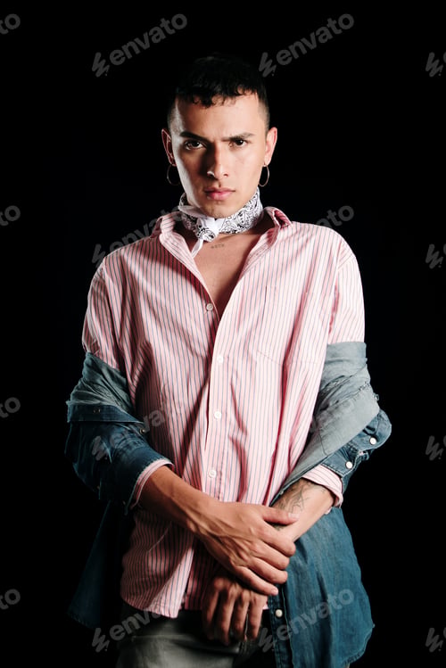Preview: Serious young man looking at camera