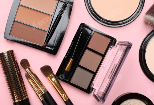 Preview: Flat lay composition with colorful eyeshadow palettes, powders and makeup brushes on pink background