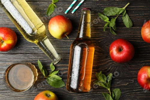 Preview: Composition with cider, apples and straws on wooden background