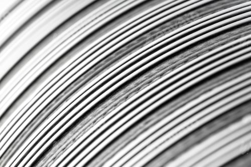 Preview: Background made from a macro photo of a flexible corrugated aluminum tube surface.