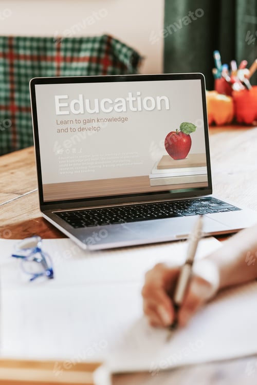 Preview: Blond girl using laptop for online class, the new normal