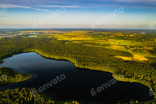 Preview: Top view of Bolta lake in the forest in the Braslav lakes National Park at dawn, the most beautiful