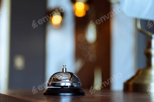 Preview: Hotel service bell on a table in hotel. Concept of hotel or restaurant