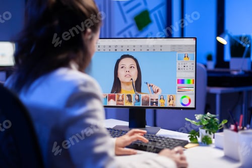 Preview: Freelancer retoucher woman working overtime on laptop computer