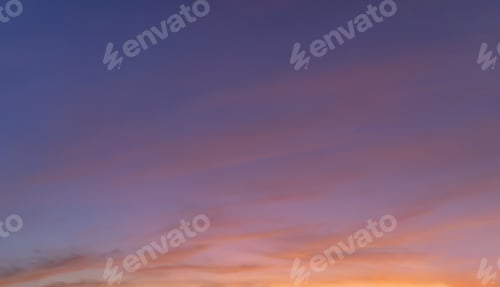 Preview: Sunset sky. Abstract nature background. Dramatic blue and orange, colorful clouds at twilight time.