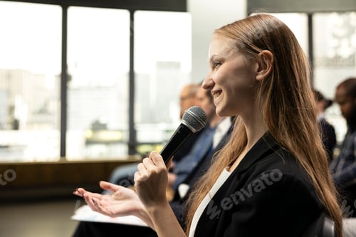 Preview: Close up of young adult asking questions on microphone and interacting