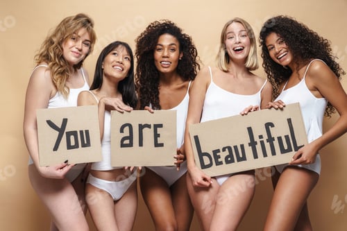 Preview: Image of young multinational women smiling and holding placards