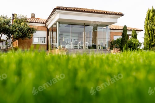 Preview: Private house entry with porch. Low angle view from the garden grass