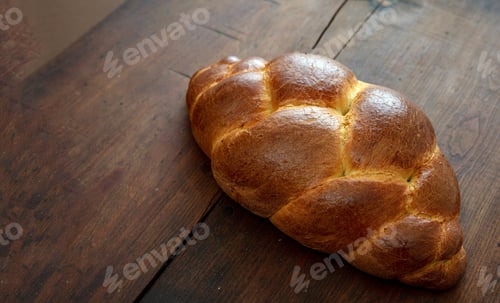 Preview: Easter tsoureki braid, greek easter sweet bread, on wooden background