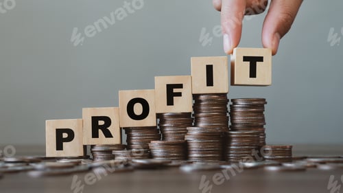 Preview: Profit.Wooden block with PROFIT word on stack coin.Business, finance, marketing, e-commerce concept.
