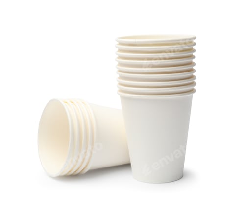 Preview: Disposable tableware. Stacks of paper cups isolated on white