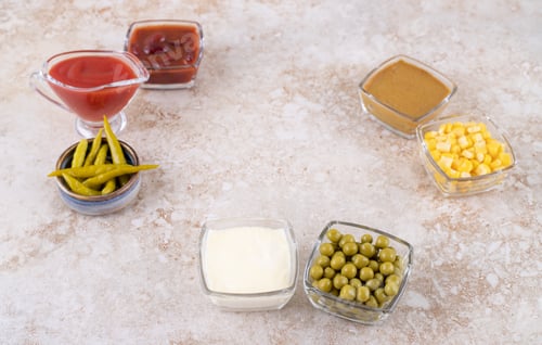 Preview: Assorted dressings and toppings on marble background