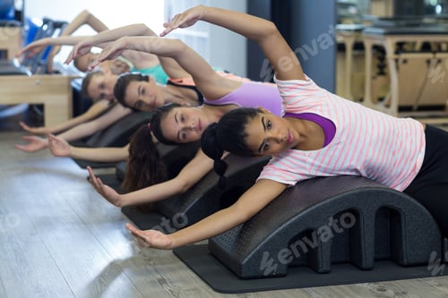 Preview: Group of women exercising on arc barrel