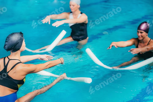 Preview: Water Aerobics Class, Group of Women Exercising with Instructor