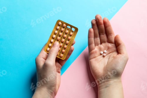 Preview: Woman with contraceptive pills on color background, closeup
