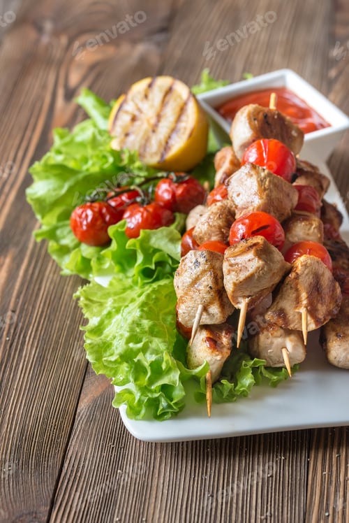 Preview: Grilled chicken skewers on the white plate