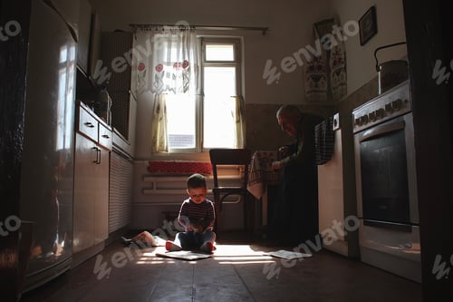 Preview: Grandfather looks at his little great-grandson
