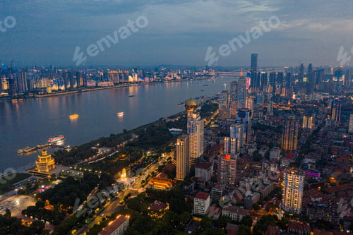 Preview: Aerial view of the Yangtze River, Wuhan lit up with lights, and skyscrapers on both sides