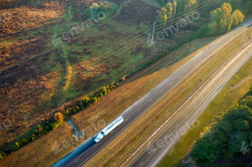 Preview: Aerial view of busy american freeway with fast moving cars and trucks.