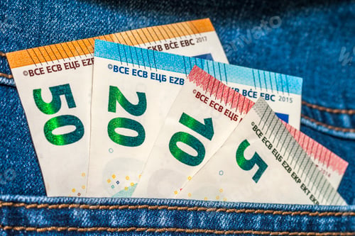Preview: Euro money banknotes in a pocket of blue jeans close up