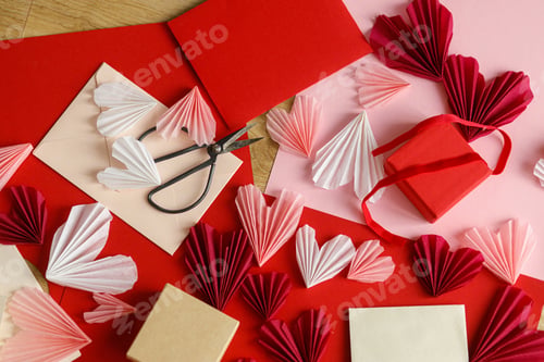 Preview: Stylish envelope with red and pink hearts, scissors, gift box and paper