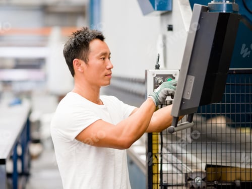 Preview: Asian worker in production plant on the factory floor