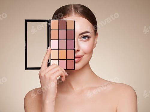 Preview: Beauty woman with eye shadow makeup palette