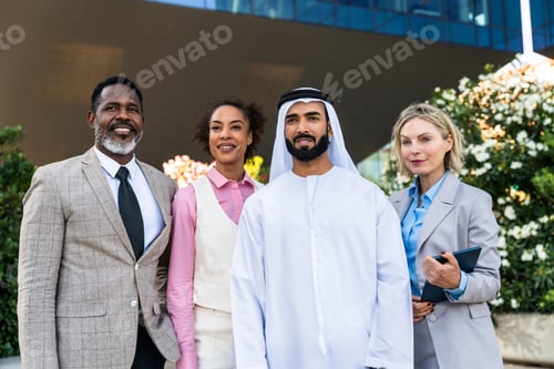 Preview: Group of multiethnic business people meeting an emirati businessman