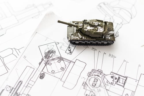 Preview: Military machine in the contour lines on graph paper. The contours of the black line on the white