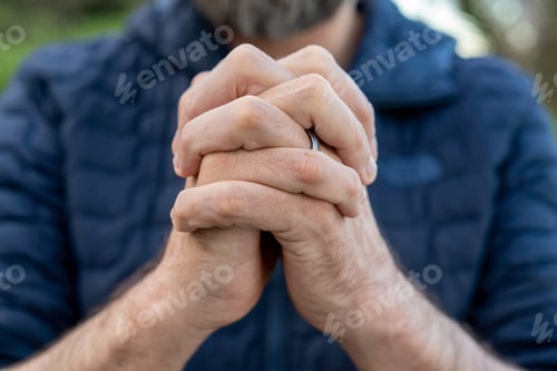 Preview: Praying hands of young man