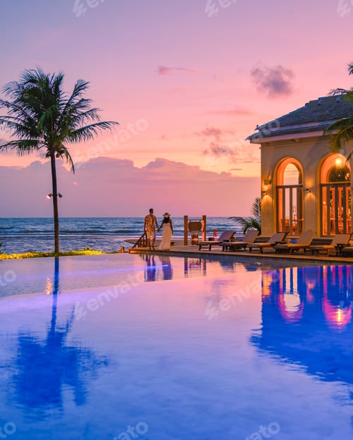 Preview: a young couple of men and women at a swimming pool during a vacation on a tropical island watching
