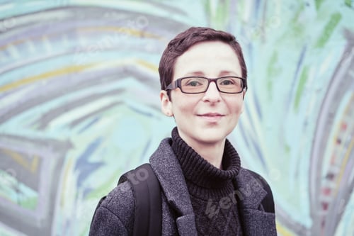 Preview: Portrait of woman with short haircut. Androgynous appearance, non-binary personality.