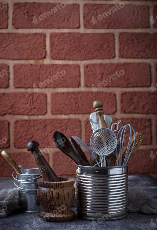 Preview: Kitchen utensils on brick wall background