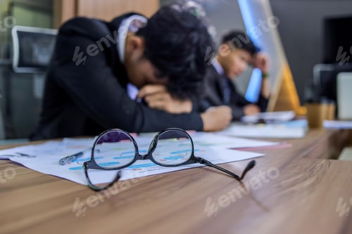 Preview: Male Employee Sleeping and Tired While in Conference, Selective Focus on Eyeglasses