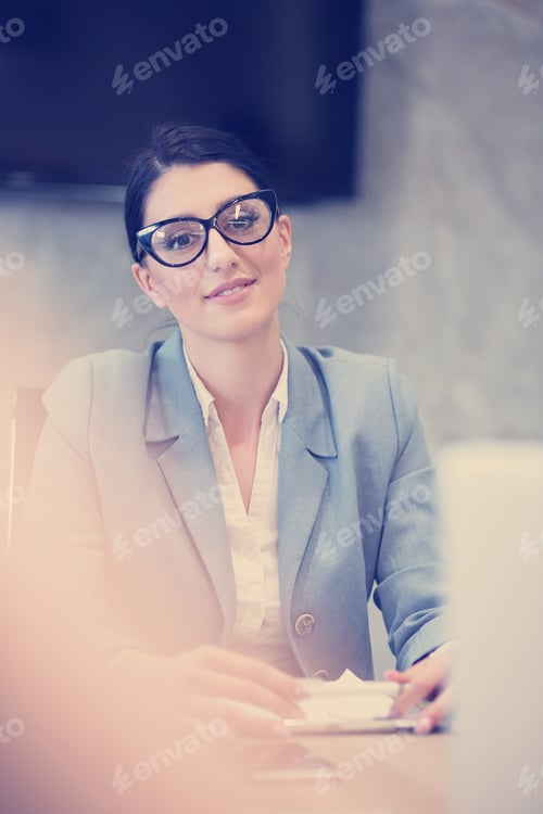 Preview: Confident Woman in Business Attire at Office