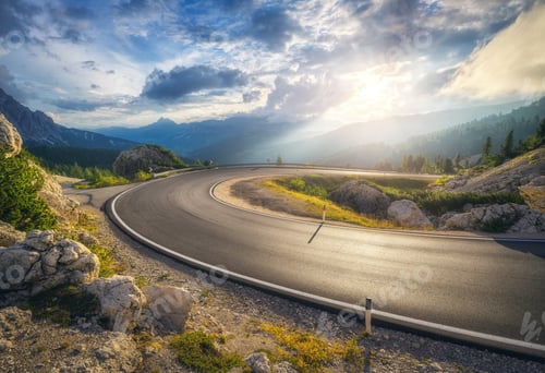 Preview: Mountain road at colorful sunset in summer. Curved roadway