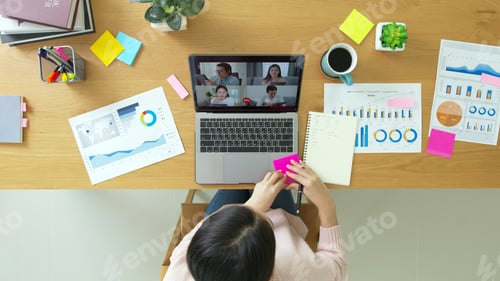 Preview: Top view of business woman talking about sale report in video conference