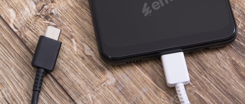 Preview: Smartphone with charger cables. Telephone charging concept