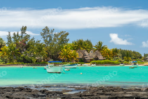 Preview: Boats anchored in a turquoise lagoon