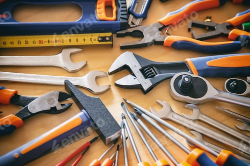 Preview: DIY, maintenance service works concept. Home repair tools set on wooden background.