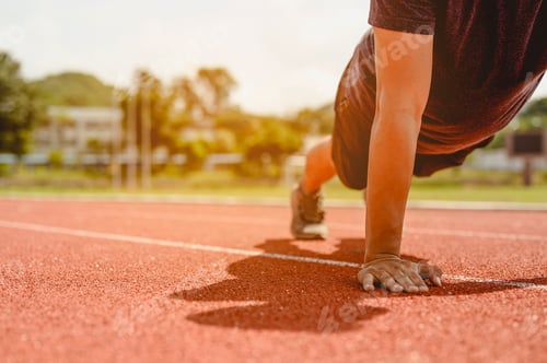 Preview: The young man wore all parts of his body to prepare for jogging on the running track.