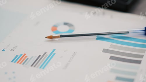 Preview: Business paperwork on office desk next to cup of coffee, extreme close up shot