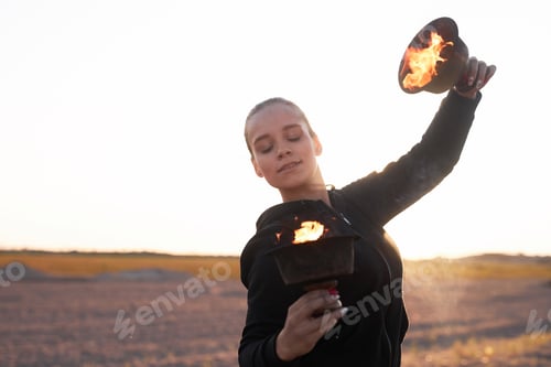 Preview: Woman Dancing with Flame Bowls During Fire Show
