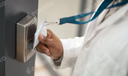 Preview: Closeup shot of an unrecognisable scientist using an access card to gain entry at a door
