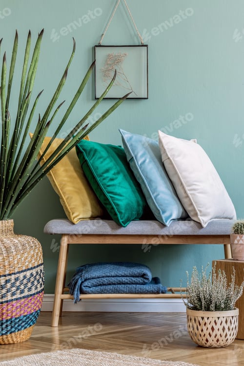 Preview: Stylish composition of cozy living room interior details and colourful classy pillows.